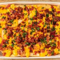 Bucket Of Bacon Cheese Fries · Jersey fries topped with cheese sauce and bacon bits.