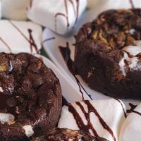 S'Mores Lava Cookie · 2 layers of s'mores cookies stuffed with marshmallows Graham crackers and Hershey kisses bak...