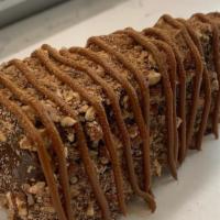 Pecan Pie Cheesecake · New York cheesecake dipped in Ghirardelli milk chocolate rolled in toasted pecan drizzled wi...