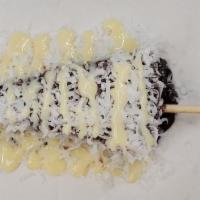 The Exotic Cheesecake · New York cheesecake dipped in Ghirardelli milk chocolate rolled in coconut and drizzled with...