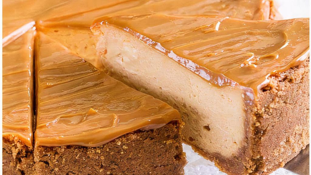 Dulce De Leche Cheesecake · A cookie crust holds a velvety dulce de leche cheesecake, topped with dulce de leche mousse and chocolate shavings.