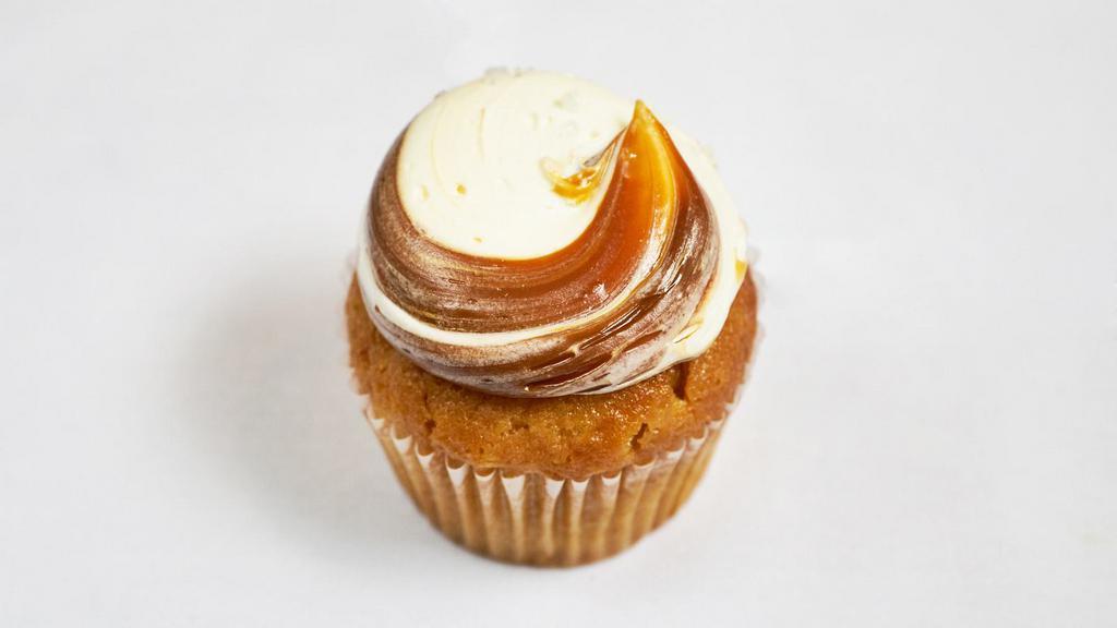 Salted Caramel Cupcake · Vanilla cake with vanilla caramel swirled buttercream sprinkled with sea salt.