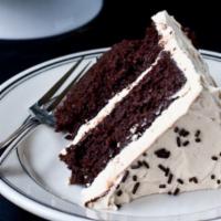 Chocolate Cake With Vanilla Buttercream · Layers of vanilla cake stuffed and covered with delicious creamy chocolate buttercream.