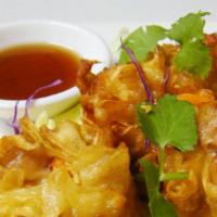 Dumpling · Delicious marinated minced chicken and shrimp, with black vinaigrette sauce.