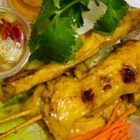 Chicken Satay · Grilled and marinated chicken skewer. Served with peanut dip and cucumber sauce.