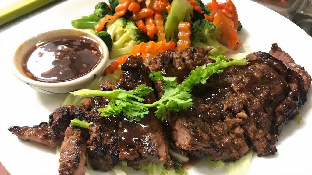 Tiger Cry Steak · Spicy. Grilled sirloin and steamed vegetables, with tamarind sauce. Served with jasmine rice.