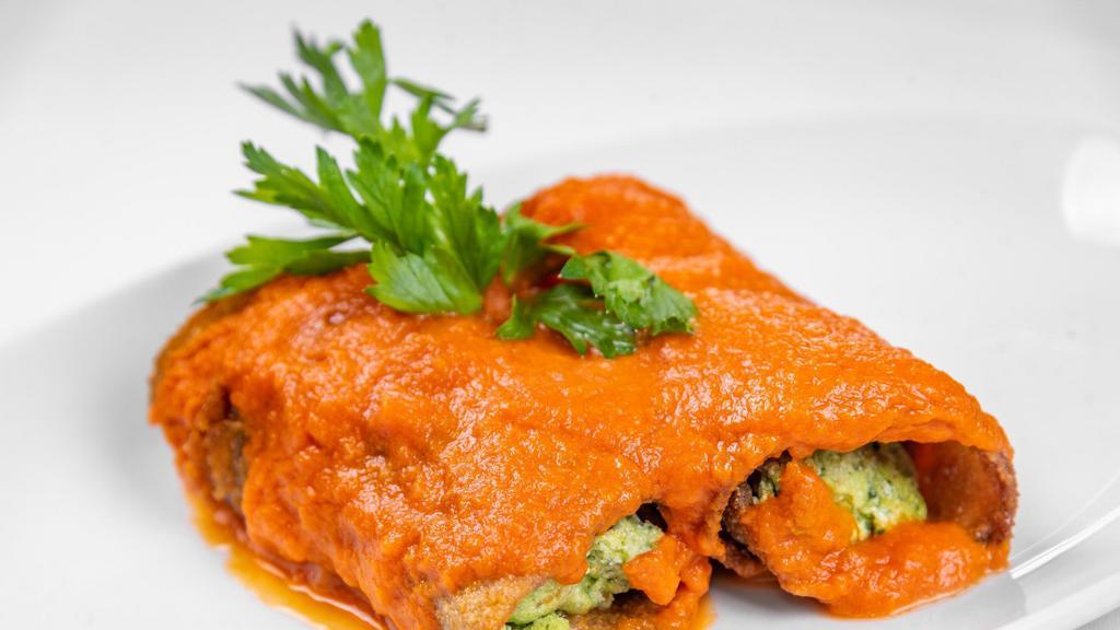 Melenzane Rollatine · Rolled breaded eggplant, with tomato sauce, ricotta cheese and spinach.