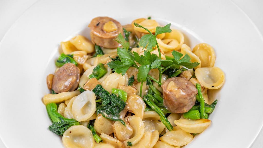 Orecchiette Caccese · Homemade Little Ears Shaped Pasta Sauteed with Chunks of Sweet Italian Sausage, Broccoli Rabe, Olive Oil and Garlic Sauce