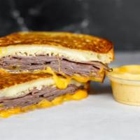 Roast Beef & Cheese Monte Cristo · Smoked ham, Cheddar, Swiss, and Parmesan cheeses melted between egg dipped, griddled sourdou...
