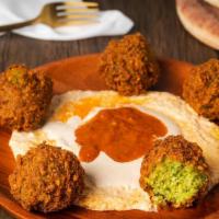 Falafel Balls · Ground chickpeas formed into five balls and fried. . Crispy on the outside, soft and savory ...