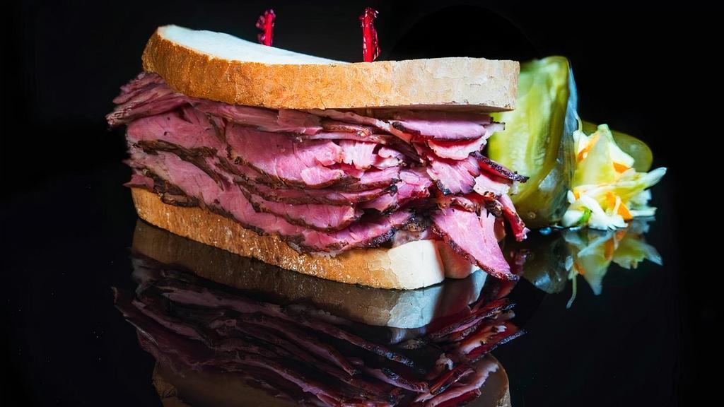 Pastrami · Delightful and hot sliced pastrami available as a Sandwich or as a Plate. . The Pastrami Sandwich includes coleslaw and pickle on the side. . The Pastrami Plate includes bread and your choice of french fries or mashed potatoes with gravy.