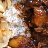 Stew Chicken Dinner · Brown Stewed Chicken served with choice of rice, veggies, and a piece of plantain.