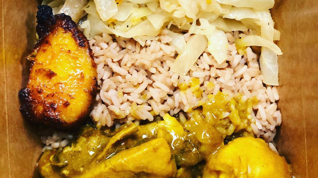 Curry Chicken Dinner · Curried Chicken served with choice of rice, veggies, and a piece of plantain.