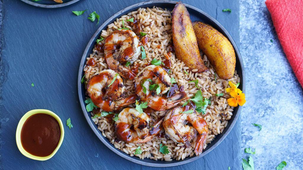 Jerk Shrimp Dinner · Marinated Jerk Jumbo Shrimp served with choice of rice, veggies, and a piece of plantain. Comes with (1) Jerk Sauce.