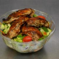 Jerk Pork Salad · Mixed garden salad with chopped romaine lettuce, mixed spring greens, shredded carrots, chop...