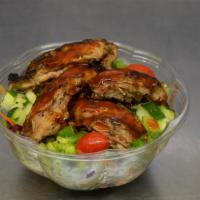 Jerk Chicken & Jerk Pork Salad · Mixed garden salad with chopped romaine lettuce, mixed spring greens, shredded carrots, chop...