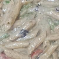 Rasta Pasta · Penne Pasta With spicy alfredo sauce with green onions, purple cabbage and tomato.