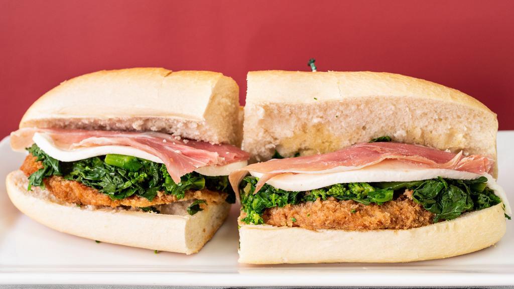 Silvana’S · Breaded Chicken  Cutlet, Broccoli Rabe, with Melted Mozzarella, and Extra  Virgen Olive Oil Atop a Thin Layer of Imported  Prosciutto.