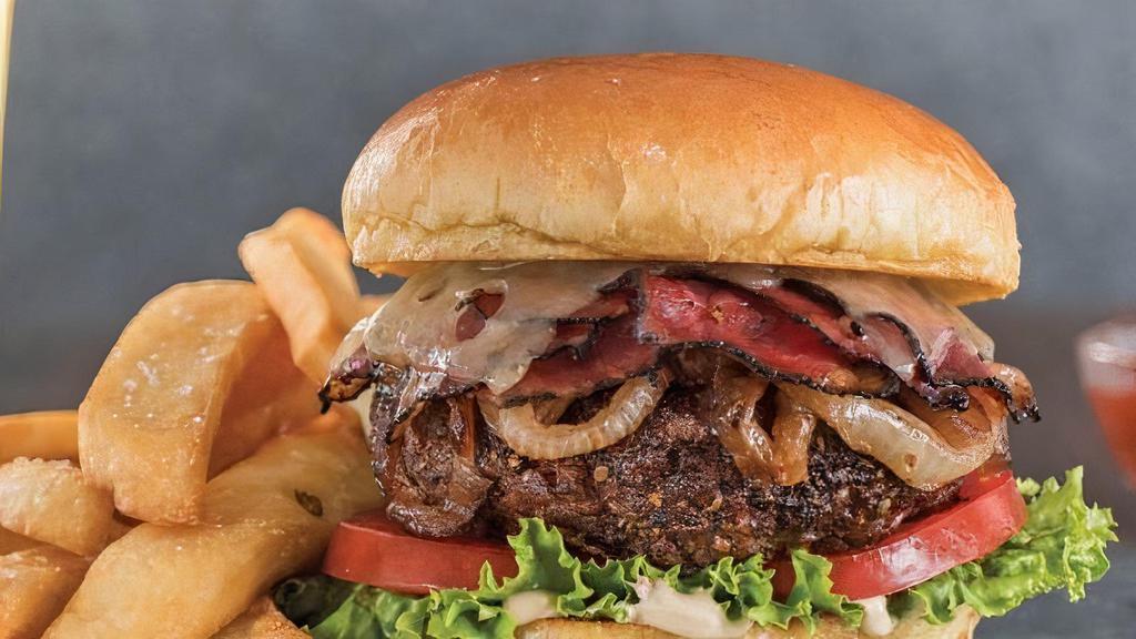 Blackmoon Burger Deluxe · Beef patty, pastrami, choice of cheese, sauerkraut, lettuce, and tomato.