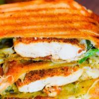 Chicken Melt Panini · Spinach chicken, grilled onions, swiss cheese, peppers, avocado, and romaine lettuce.