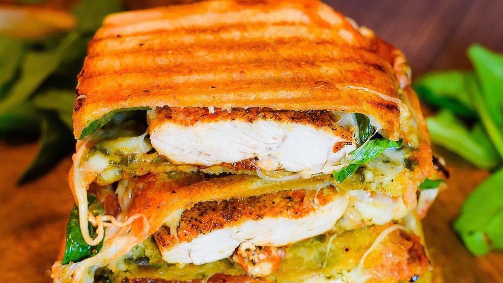 Chicken Melt Panini · Spinach chicken, grilled onions, swiss cheese, peppers, avocado, and romaine lettuce.