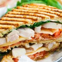 Road Runner Panini · Grilled chicken, grilled onions, spinach, muenster cheese, beef bacon, lettuce, and tomato.