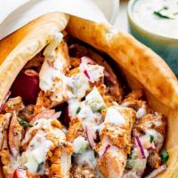 Chicken Gyro · Pita, halal chicken , lettuce, tomatoes ,cucumber, white and hot sauce.