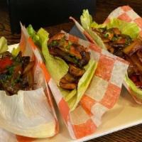 Chicken Lettuce Wraps · Sautéed chicken, peppers, onions, mushrooms & scallions in a light teriyaki sauce. Served in...