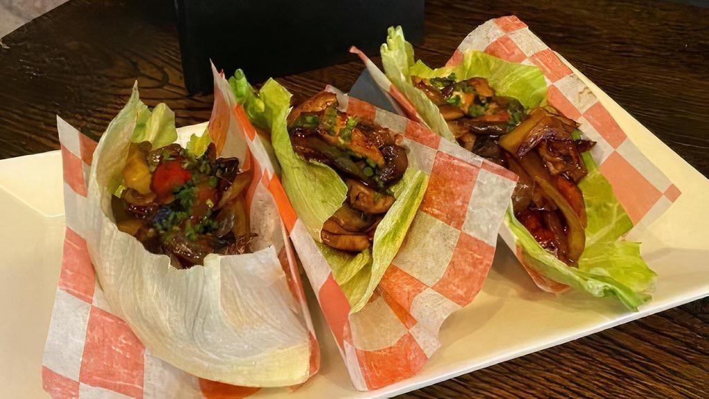 Chicken Lettuce Wraps · Sautéed chicken, peppers, onions, mushrooms & scallions in a light teriyaki sauce. Served in iceberg lettuce cups.