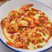 New! Shrimp & Grits · Grilled shrimp with blackening seasoning served over creamy cheese grits in a Cajun beurre b...