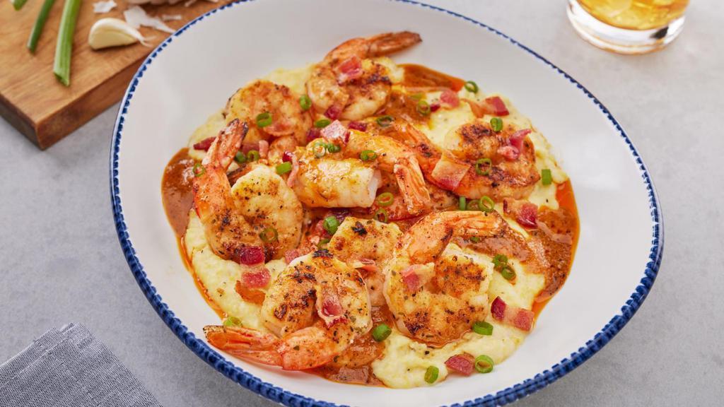 New! Shrimp & Grits · Grilled shrimp with blackening seasoning served over creamy cheese grits in a Cajun beurre blanc, topped with crispy bacon.. 950 Cal