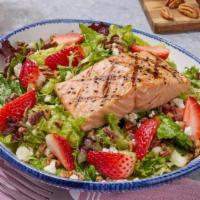 New! Strawberry-Pecan-Salmon** Salad · Grilled salmon, strawberries, feta, pecans, and a strawberry balsamic vinaigrette served ove...