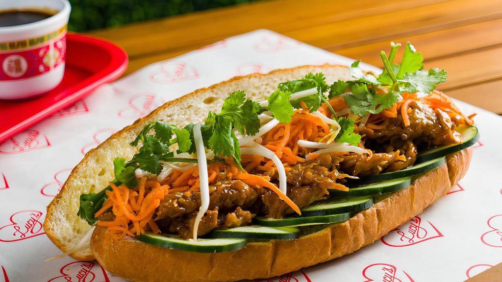 Vegan Ginger Chick'N Banh Mi · Sautéed vegan ginger chick'n served with house garlic aioli (non-vegan, optional),  jalapeno, cucumber, pickled carrots, bean sprouts, and cilantro. Chick'n is 100% vegan, made with non-GMO soybeans, dairy and cholesterol free - flavored with ginger/basil, perfectly spiced with great texture!