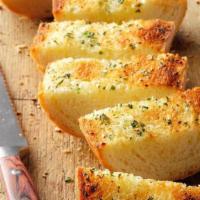Toasted Garlic Aioli Bread · Toasted Baguette with house Garlic Aioli and scallions