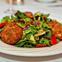 Goat Cheese Salad · Warm fried goat cheese. Served over mixed greens with craisins, pecans, cherry tomatoes, and...