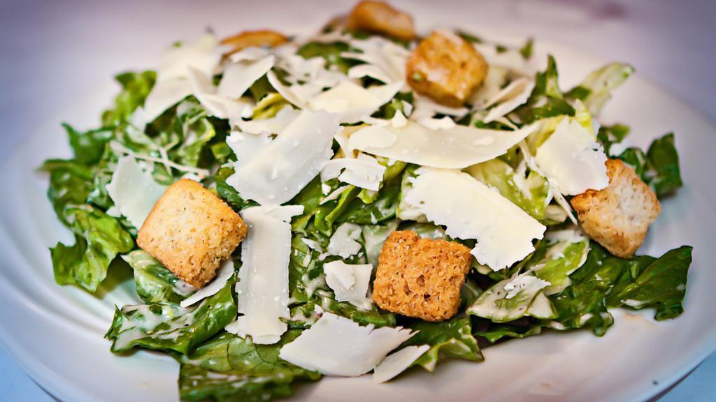 Caesar Salad · Romaine lettuce with shaved parmesan cheese, seasoned croutons, and hard boiled egg.