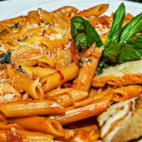 Penne A La Vodka · Penne with diced onions in a creamy vodka tomato sauce. Served with garlic bread.
