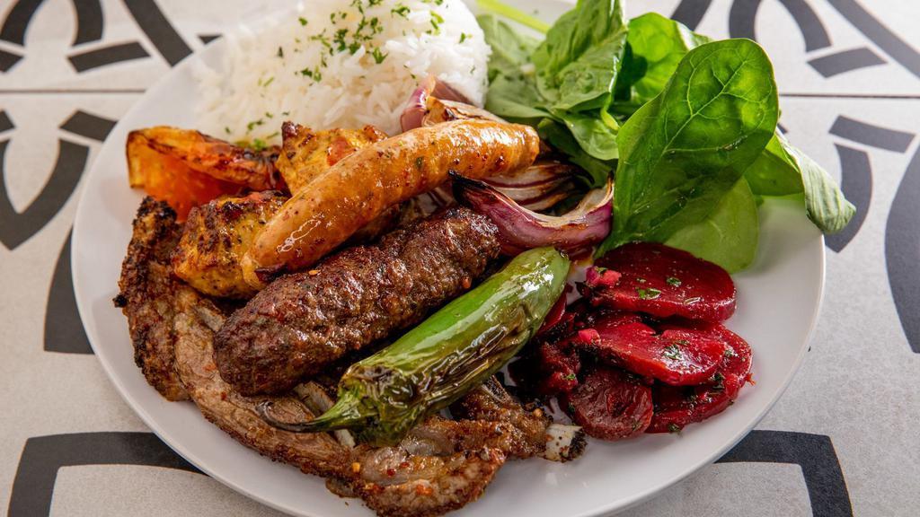 Mixed Bbq Platter · Grilled lamb cutlet, chicken kebab and lamb kofta kebab. Served with white basmati rice, green salad, grilled tomatoes, onions and jalapeño.