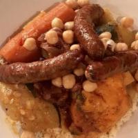 Veggie Couscous · Steamed semolina grain served with vegetable bouillon with carrots, sweet potato, zucchini, ...