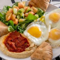 Moroccan Breakfast · 3 eggs any style. Served with homemade hummus, spicy tomato sauce, green salad and whole whe...
