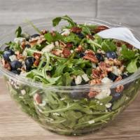 Blueberry Arugula · Fresh blueberries, gorgonzola, pecans and topped with honey, extra virgin olive oil dressing.