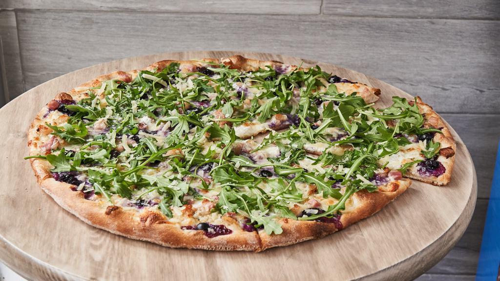 Blueberry And Pancetta Pizza · Fresh blueberries, Gorgonzola and Pancetta. Topped with Parmigiano Reggiano and arugula.