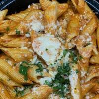 Penne Alla Vodka · Penne and vodka sauce topped with Parmigiano Reggiano.