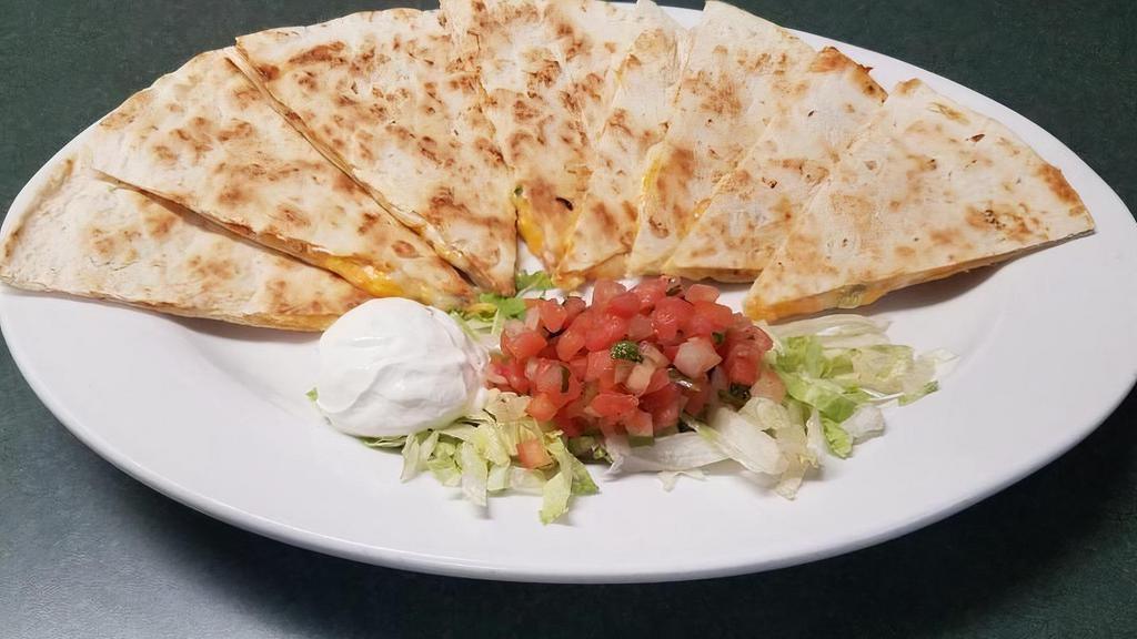 *Quesadillas · flour tortillas, cheddar cheese, tomatoes, fire-roasted peppers . and onions, sour cream, pico de gallo