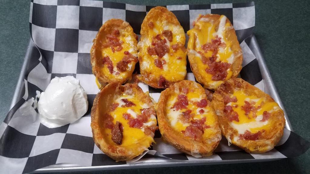 *Loaded Potato Skins · topped with cheddar cheese, bacon, served with sour cream