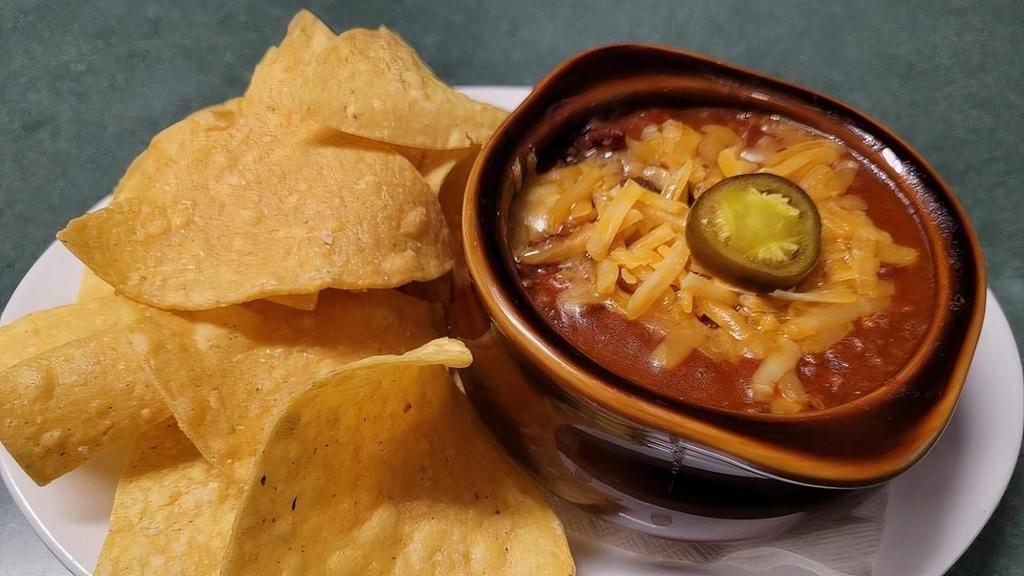 *Crock Homemade Chili · with cheddar cheese, jalapeño slice, corn tortilla chips