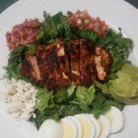 *Chicken Cobb Salad · salad greens, cajun-spiced grilled chicken, pico de gallo, bacon, crumbled. bleu cheese, egg...