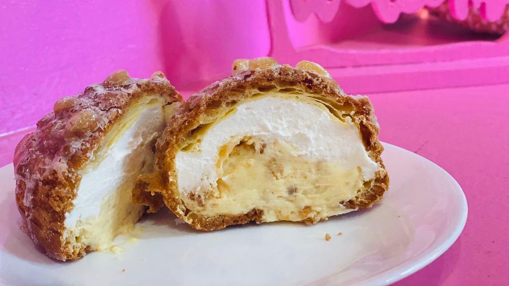 Double Cookie Cream Puff · Cookie crust puff with crunchy sugar, filling is custard cream and whip cream with cookie pieces inside.