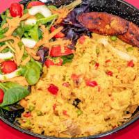 Arroz Con Pollo · Saffron rice mixed with shredded chicken and vegetables. Served with green salad and sweet p...