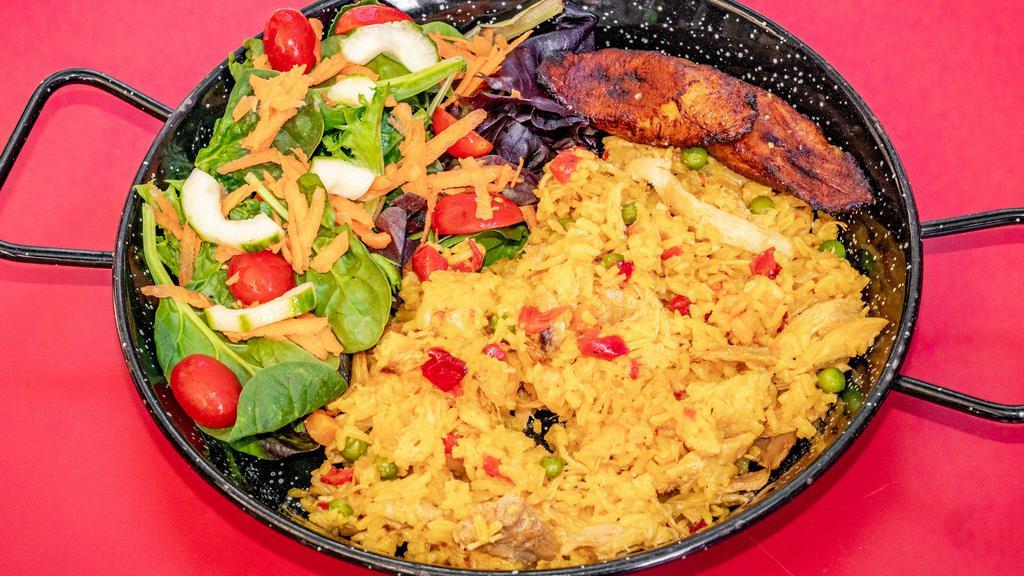 Arroz Con Pollo · Saffron rice mixed with shredded chicken and vegetables. Served with green salad and sweet plantains.